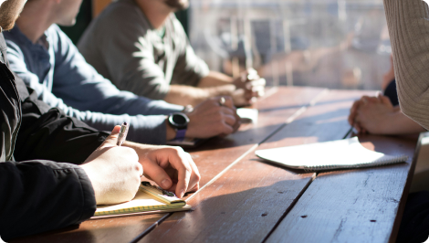 Photo of people sitting at a table.